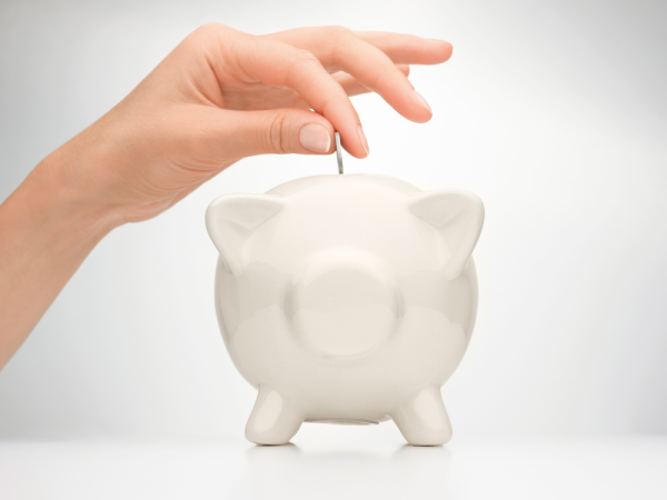 White_Piggy_Bank_with_Person_Adding_Money-1000x750.png