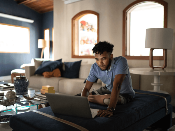 Young_Man_with_Prostetic_Leg_on_Computer_at_Home_-_Copy-1000x750-34bab08.min_.png